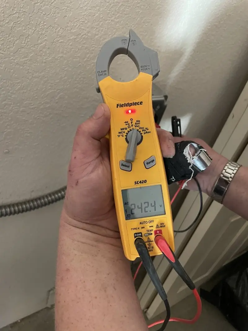 Voltage testing with clamp meter during Generator Installation in Andover